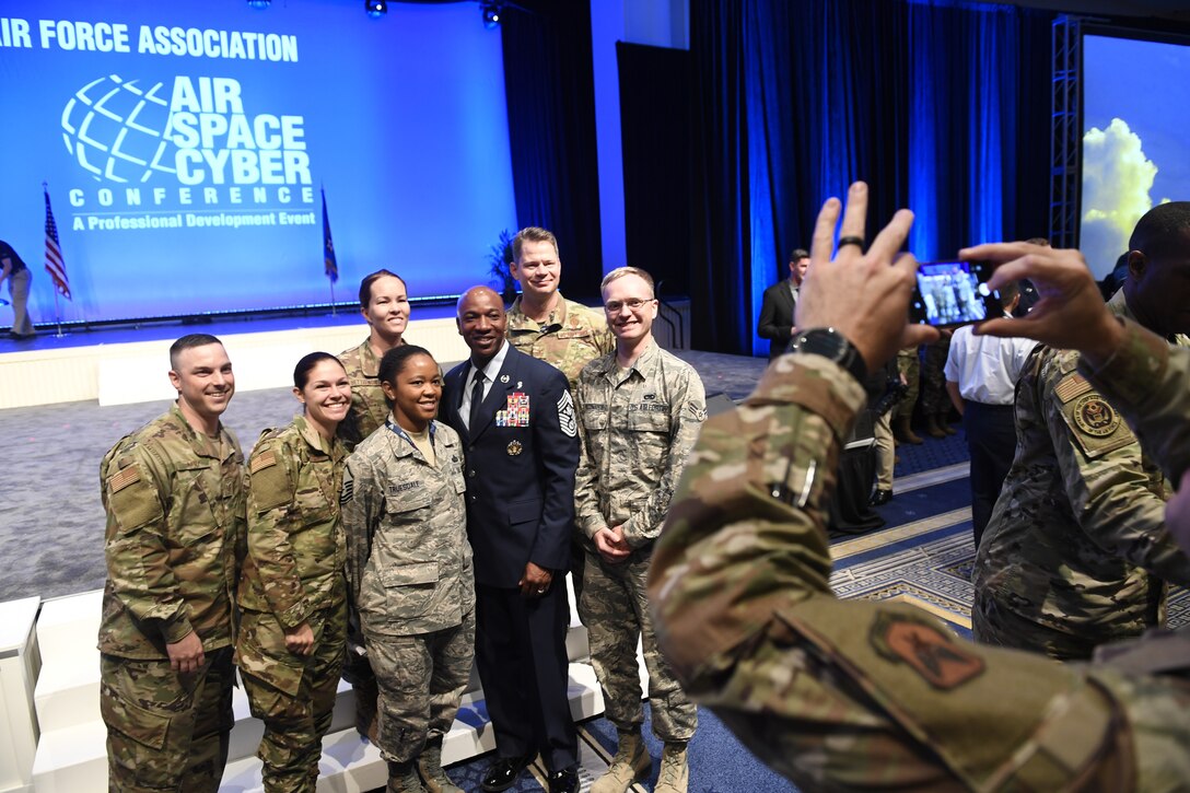 Chief Master Sgt. of the Air Force Kaleth O. Wright poses for selfies with Airmen after delivering a speech on leading with purpose during the Air Force Association’s Air, Space and Cyber Conference in National Harbor, Md., Sept. 18, 2019. The ASC Conference is a professional development seminar that offers the opportunity for Department of Defense personnel to participate in forums, speeches and workshops. This annual event features engaging speakers and panels focused on airpower, space and cyber developments and a technology exposition featuring the latest technology, equipment and solutions for tomorrow’s problems. The ASC has something for everyone. (U.S. Air Force photo by Andy Morataya)