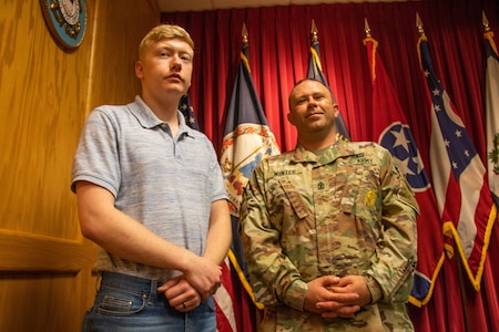 U.S. Army Pvt. 1st Class Michael Winter (left) stands next to father, 1st Sgt. Timothy Winter (right), while he waits to conduct his Oath of Enlistment Sept. 8, 2019 at the Beckley Military Entrance Processing Station, or MEPS, in Beckley, West Virginia. It is at this exact MEPS station where Timothy recited his Oath of Enlistment nearly 20 years ago.
