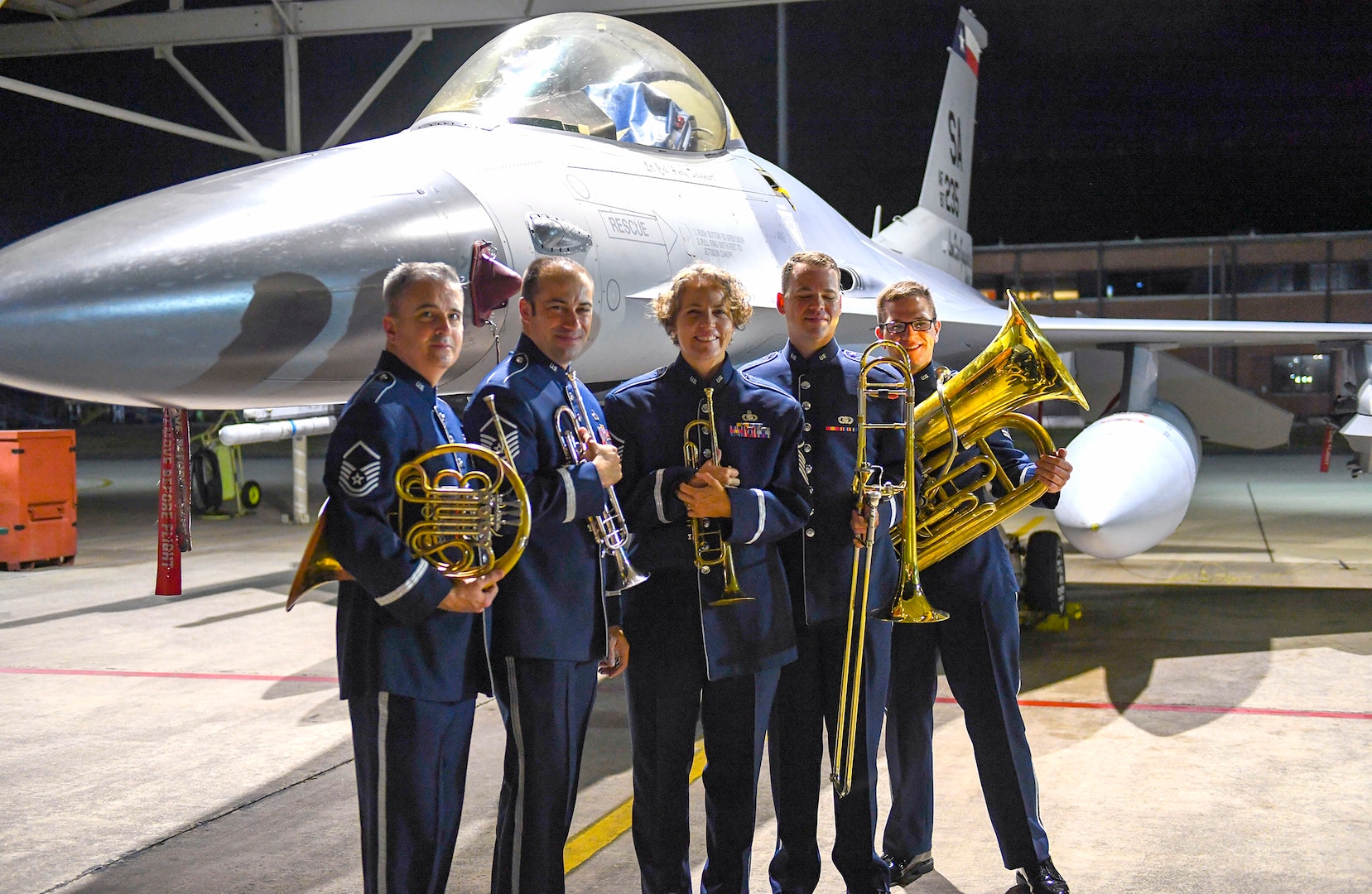 Members of the United States Air Force Band of the West pose in front of an F-16 Fighting Falcon, an aircraft assigned to the 149th Fighter Wing Sept. 18 at Joint Base San Antonio-Lackland in honor of the Air Force’s 72nd birthday.