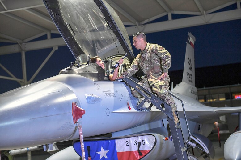 Master Sgt. David Romero, a crew chief assigned to the 149th Fighter Wing, Air National Guard, talks to San Antonio weather reporter Jeannette Calle at Joint Base San Antonio-Lackland Sept 18. Local weather reporters conducted a live weather broadcast at JBSA-Lackland in honor of the Air Forces’ 72nd birthday.