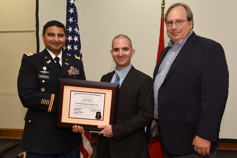 Michael Kenyon, U.S. Army Corps of Engineers Nashville District, receives a certificate of completion for the 2019 Leadership Development Program Level I Course from Lt. Col. Sonny B. Avichal, Nashville District commander, and Michael Evans, course instructor, during a graduation ceremony Sept. 12, 2019 at the Scarritt Bennett Center in Nashville, Tenn. (USACE Photo by Lee Roberts)