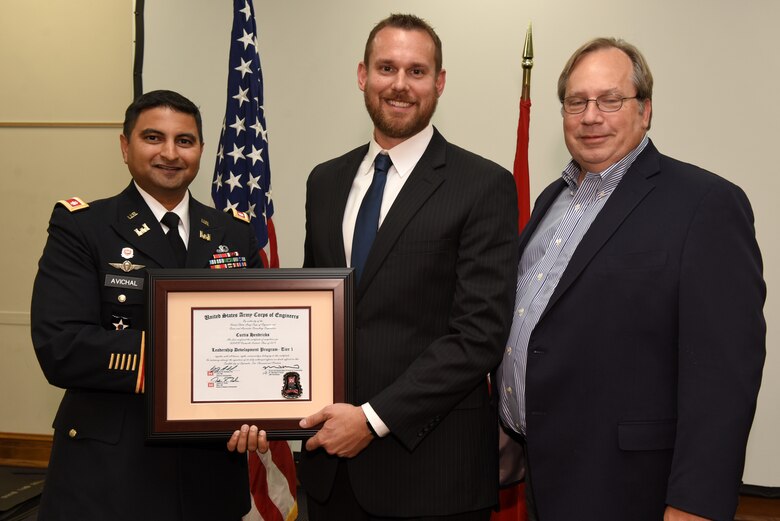 Curtis Hendricks, U.S. Army Corps of Engineers Nashville District, receives a certificate of completion for the 2019 Leadership Development Program Level I Course from Lt. Col. Sonny B. Avichal, Nashville District commander, and Michael Evans, course instructor, during a graduation ceremony Sept. 12, 2019 at the Scarritt Bennett Center in Nashville, Tenn. (USACE Photo by Lee Roberts)