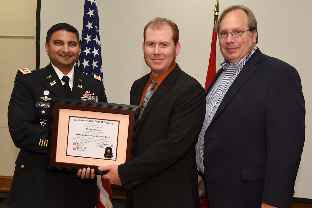Wesley Davenport, U.S. Army Corps of Engineers Nashville District, receives a certificate of completion for the 2019 Leadership Development Program Level I Course from Lt. Col. Sonny B. Avichal, Nashville District commander, and Michael Evans, course instructor, during a graduation ceremony Sept. 12, 2019 at the Scarritt Bennett Center in Nashville, Tenn. (USACE Photo by Lee Roberts)