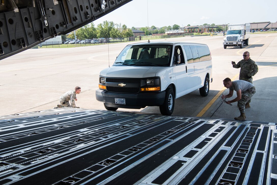 U.S. Air Force Airmen monitor a van being loaded onto a U.S. Air Force C-17 Globemaster III from the Mississippi Air National Guard’s 172nd Airlift Wing during a Joint Task Force Civil Support exercise at Joint Base Langley-Eustis, Virginia, Sept 11. 2019. Vehicles like this van and the truck behind it were loaded onto the C-17 and transported to Richmond, Virginia. (U.S. Air Force photo by Airman 1st Class Marcus M. Bullock)