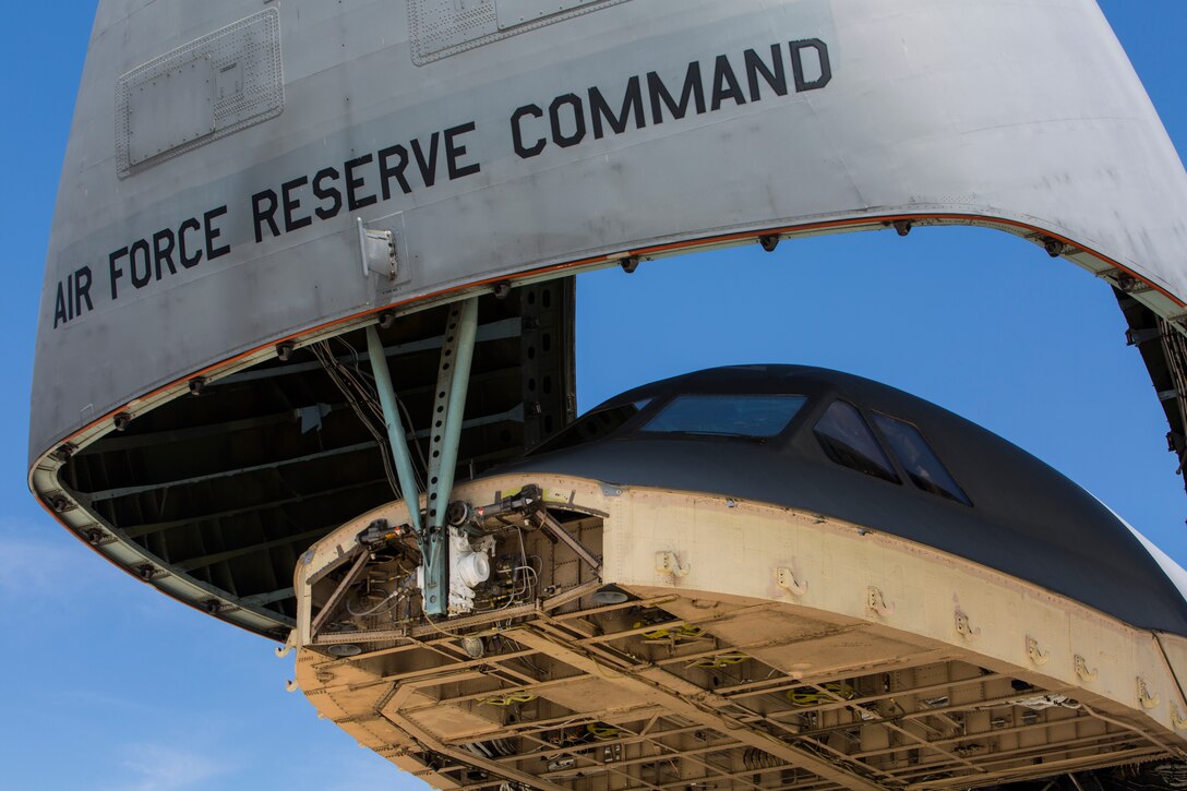 A U.S. Air Force C-5M Super Galaxy opens its hatch in preparation to load a U.S. Marine Corps UH-1Y Venom on Marine Corps Air Station Camp Pendleton, Calif., Sept. 16, 2019. The C-5M was a part of the U.S. Air Forces 433rd Air Lift Wing and was visiting 3rd Marine Aircraft Wing (MAW) in preparation for NATO Day in the Czech Republic. (U.S. Marine Corps photo by Cpl. Levi J. Guerra)