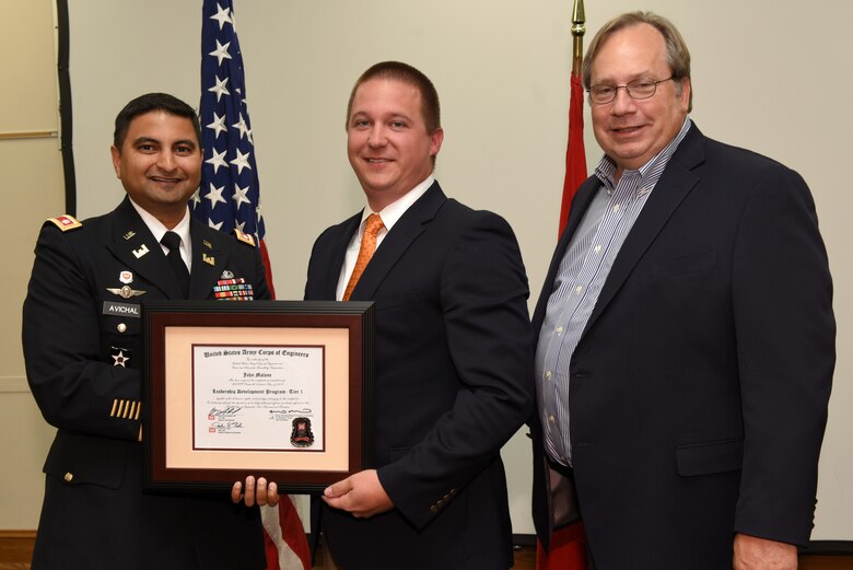 John Malone, U.S. Army Corps of Engineers Nashville District, receives a certificate of completion for the 2019 Leadership Development Program Level I Course from Lt. Col. Sonny B. Avichal, Nashville District commander, and Michael Evans, course instructor, during a graduation ceremony Sept. 12, 2019 at the Scarritt Bennett Center in Nashville, Tenn. (USACE Photo by Lee Roberts)