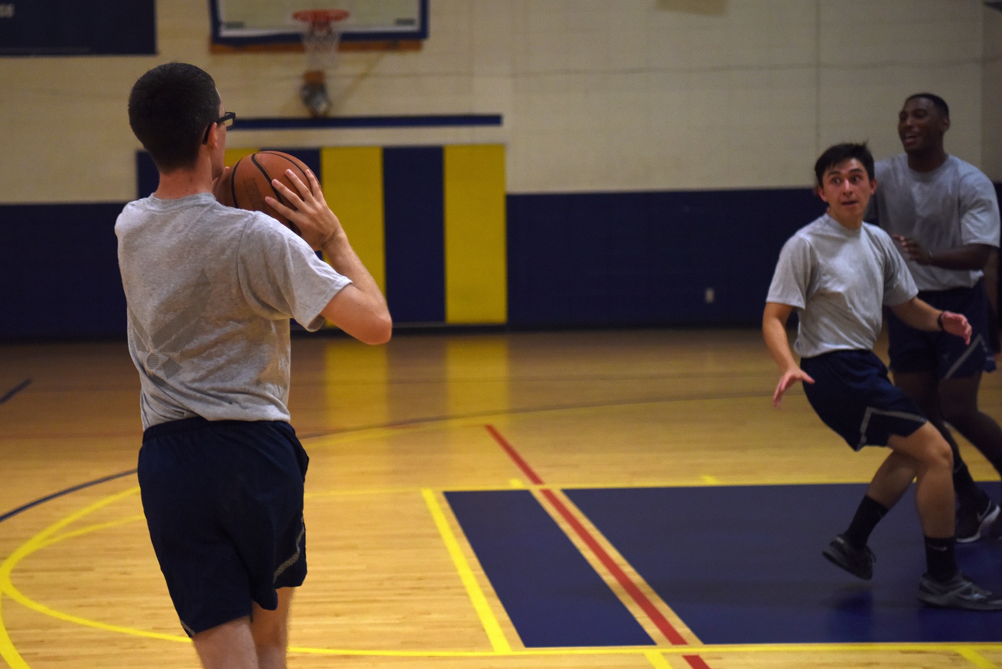 U.S. Air Force Airman Cade Hammerling, 336th Training Squadron client systems student, plays basketball inside the Blake Fitness Center on Keesler Air Force Base, Mississippi, Sept. 11, 2019. The 336th TRS revamped their Awaiting Further Instruction program and turned it into a multi-tracked program that prepares Airmen for life in the Air Force. The new program incorporated additional time for group physical training which focuses on teamwork. (U.S. Air Force photo by Senior Airman Suzie Plotnikov)