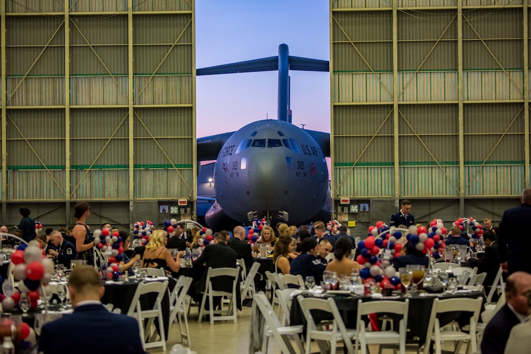 A C-17 aircraft serves as a backdrop for the 2019 Air Force Ball at Edwards Air Force Base, California, Sept. 14. (U.S. Air Force photo by Matt Williams)