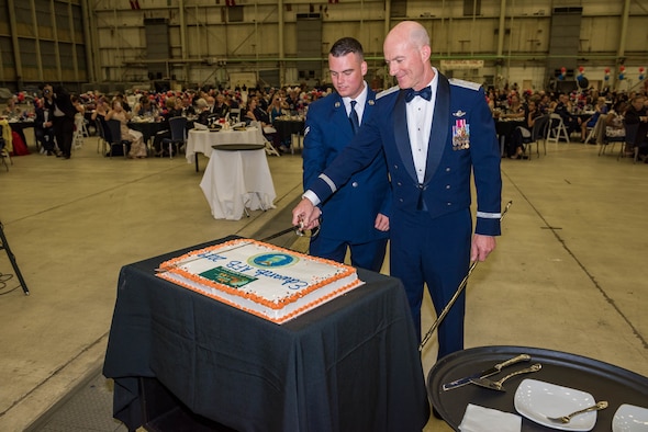 Air Force Test Center Commander, Maj. Gen. Christopher Azzano, and Airman 1st Class Liam Paul, the most-junior Airman in attendance, cut the Air Force Birthday cake during the 2019 Air Force Ball at Edwards Air Force Base, California, Sept. 14. (U.S. Air Force photo by Matt Williams)