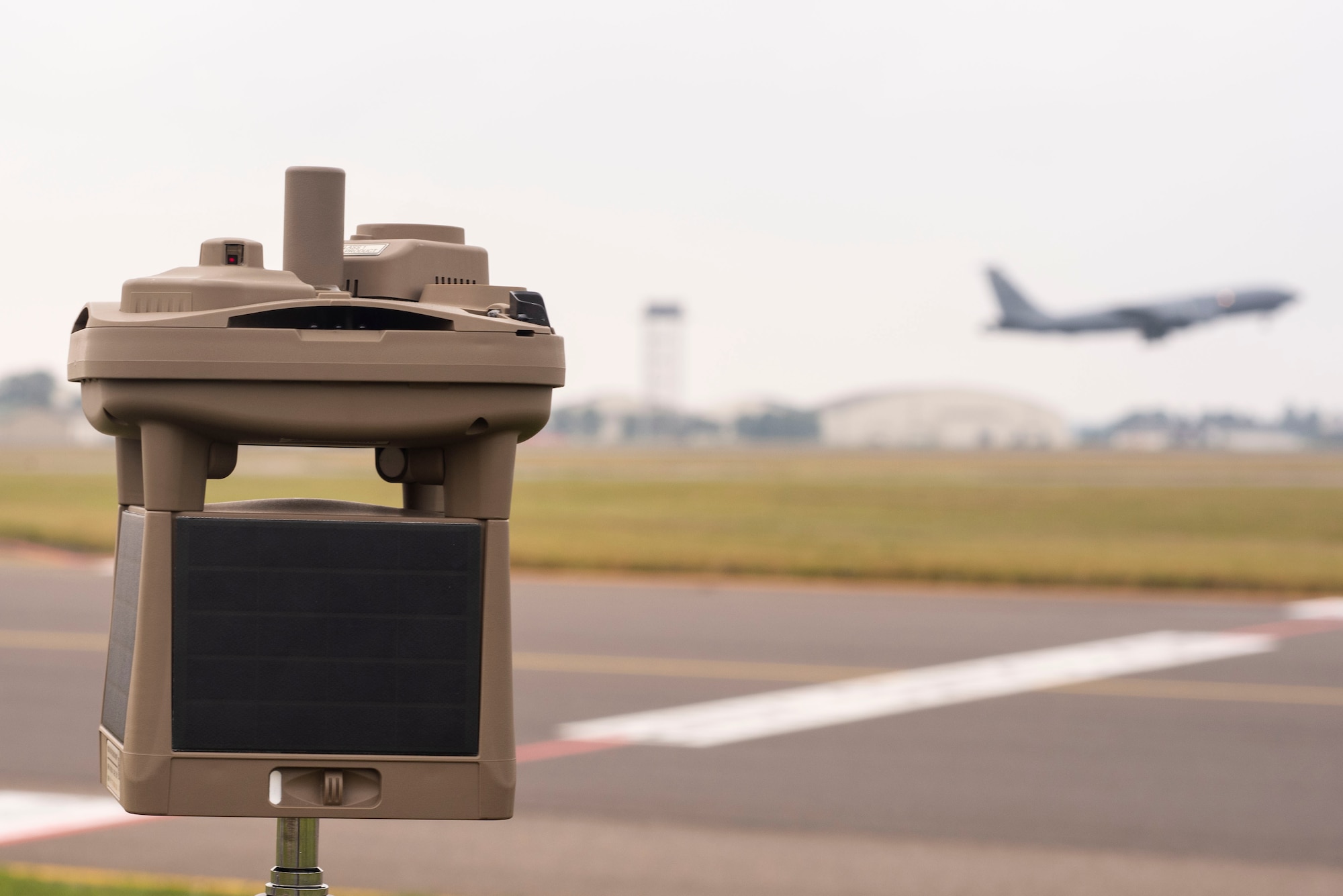 A micro weather sensor sits on the flight line Sept. 10, 2019, at RAF Mildenhall, England. The device is able to provide Airmen information on cloud height, cloud coverage, wind speed and direction, precipitation, lighting detection and atmospheric pressure. (U.S. Air Force photo by Airman 1st Class)
