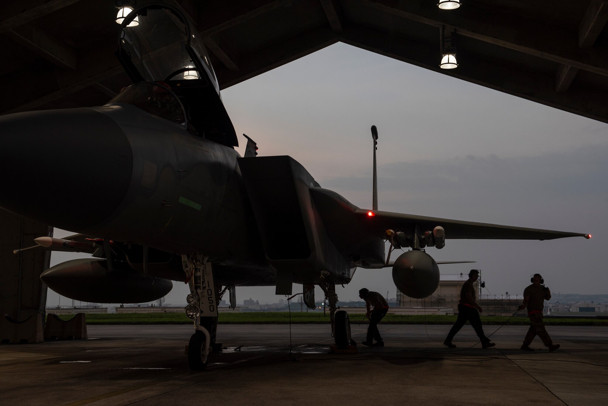 Crew chiefs assigned to the 18th Aircraft Maintenance Squadron prepare a 67th Fighter Squadron F-15C Eagle for a mission at Kadena Air Base, Japan, Sept. 16, 2019.