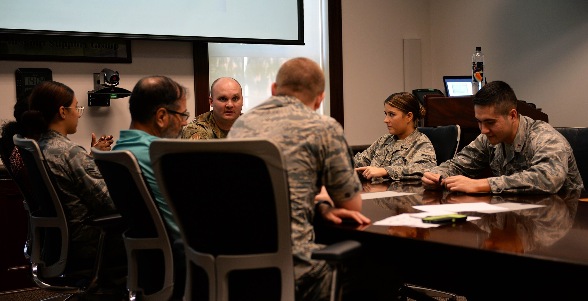 Members from the 14th Comptroller Squadron discuss various questions during a Tactical Pause Aug. 22, 2019, on Columbus Air Force Base, Miss. On Aug. 1 Chief of Staff Gen. David L. Goldfein ordered all wings to stand down for a day and focus on resiliency and suicide prevention. (U.S. Air Force photo by Airman 1st Class Hannah Bean)