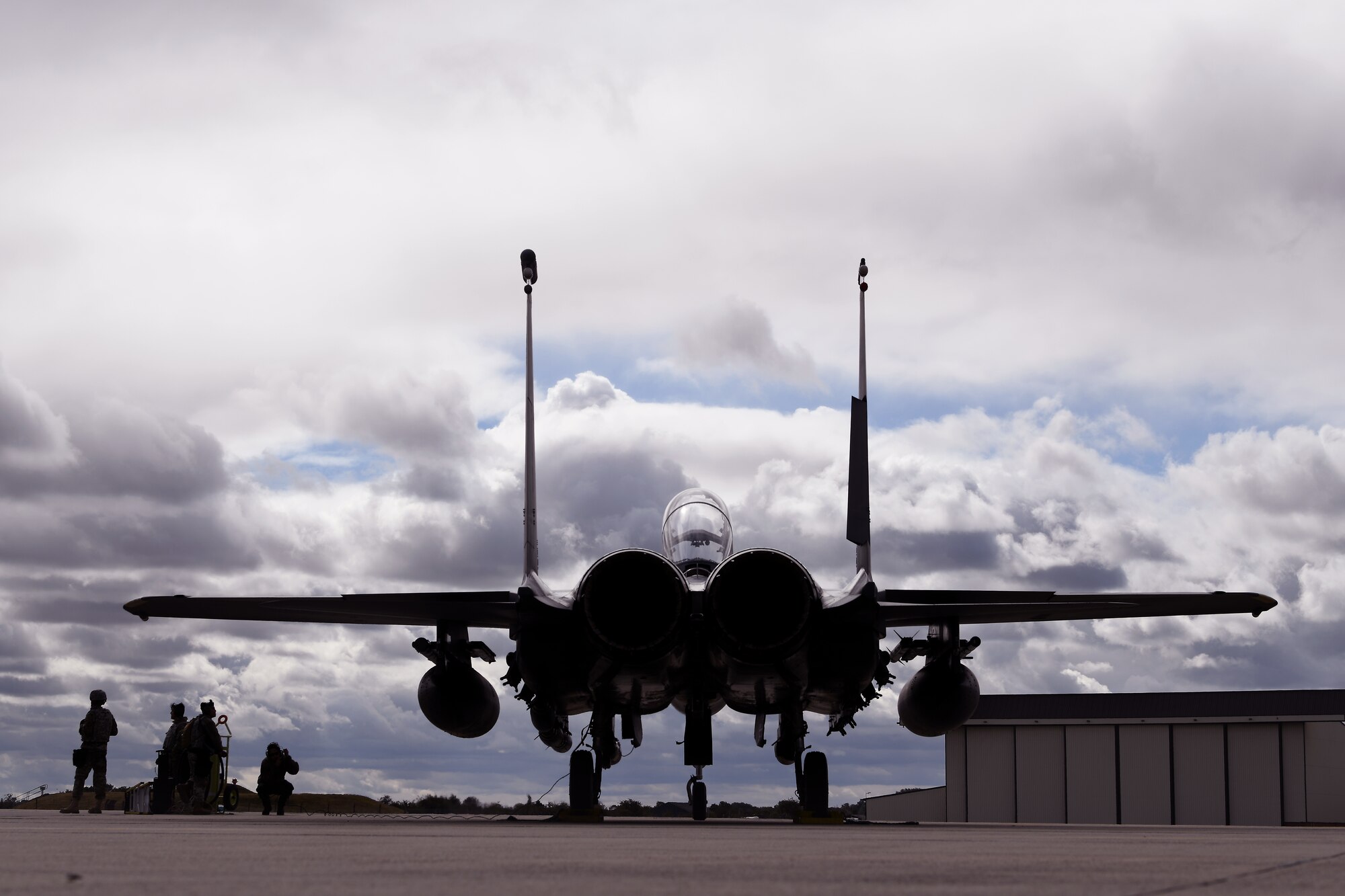 Airmen assigned to the 48th Fighter Wing and prepare to arm an F-15E Strike Eagle assigned to the 494th Fighter Squadron on the flightline at Royal Air Force Mildenhall, England, Sept. 12, 2019. The Airmen participated in a Forward Arming and Refueling Point exercise alongside the 352nd Special Operations Wing and 100th Air Refueling Wing to build upon the relationships and integration between missions among different forces. (U.S. Air Force photo by Airman 1st Class Shanice Williams-Jones)