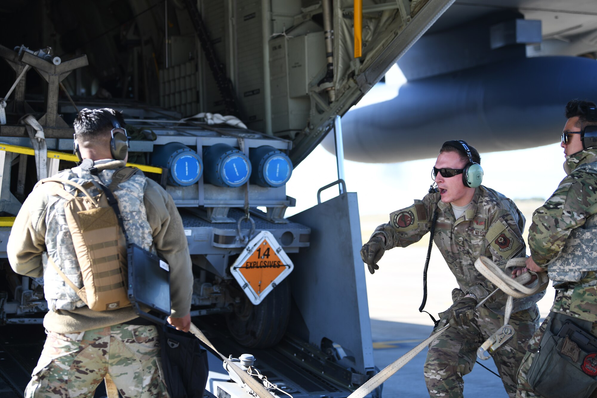 Airmen assigned to the 48th Fighter Wing and 352nd Special Operations Wing load munitions and tools onto an MC-130J Commando II in support of a Forward Arming and Refueling exercise at Royal Air Force Lakenheath, England, Sept. 12, 2019. The MC-130J platform provides precise, reliable, flexible and responsive specialized air mobility (U.S. Air Force photo by Airman 1st Class Shanice Williams-Jones)