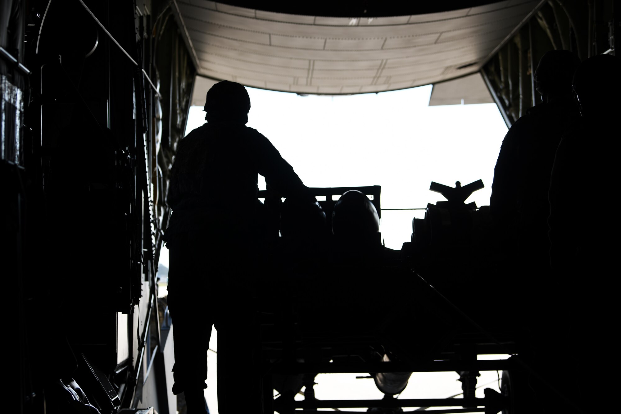 A loadmaster assigned to the 352nd Special Operations Wing prepares to unload munitions and tools in support of a Forward Arming and Refueling Point exercise at Royal Air Force Mildenhall, England, Sept. 12, 2019. FARP is a part of the U.S. Air Force’s Dynamic Force Employment capability, which consists of refueling and re-arming operations in situations where the use of conventional fueling stations or air-to-air refueling is unavailable. (U.S. Air Force photo by Airman 1st Class Shanice Williams-Jones)