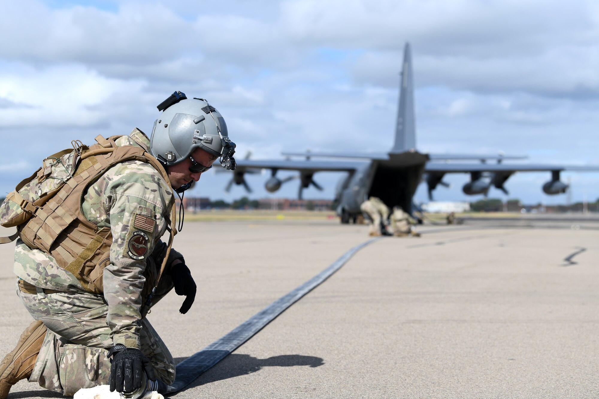 An Airman assigned to the 100th Air Refueling Wing secures a fuel line on the flightline at Royal Air Force Mildenhall, England, Sept. 12, 2019. The Airman participated in a Forward Arming and Refueling Point exercise alongside the 352nd Special Operations Wing and 48th Fighter Wing Airmen to build upon the relationships and integration between missions among different forces. (U.S. Air Force photo by Airman 1st Class Shanice Williams-Jones)