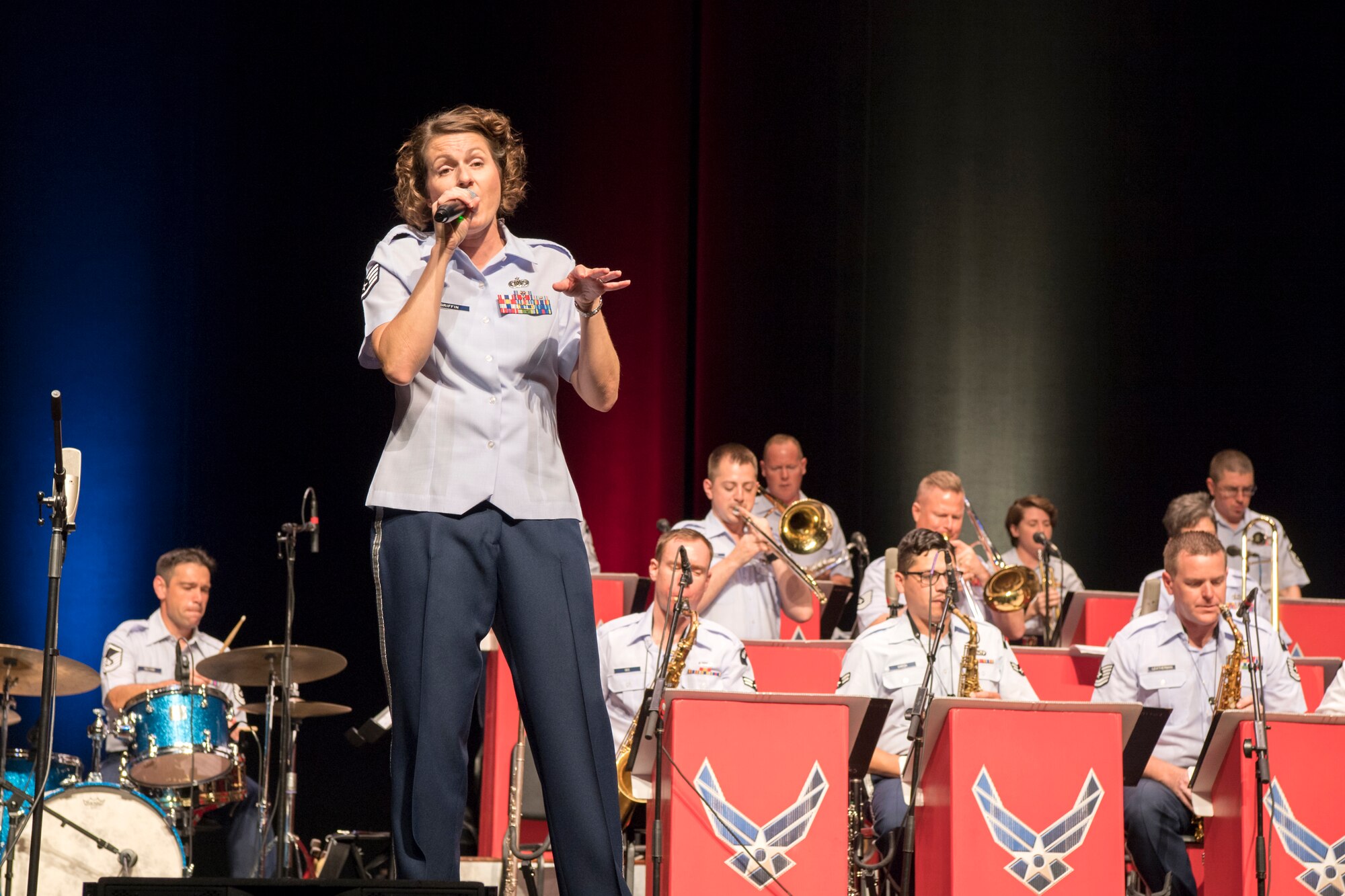 Staff Sgt. Joanne Griffin, U.S. Air Force Band of Flight vocalist, sings during a concert at the Honeywell Center in Wabash, Indiana Sept. 10, 2019. The Band of Flight partnered with the Band of Mid-America to bring back the ‘big band jazz feel’. (U.S. Air Force photo/Master Sgt. Ben Mota)