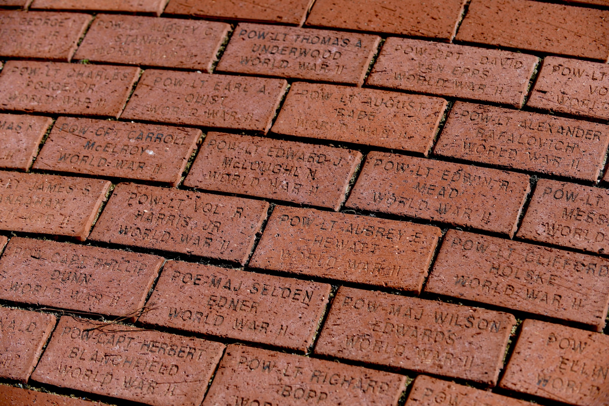 Bricks surrounding Seymour Johnson Air Force Base, North Carolina surround Heritage Park. Etched into each brick is the name of each service member that has been given the status of Prisoner of War or Missing in Action while serving in the 4 FW or its legacy units. (U.S. Air Force photo by Staff Sgt Michael Charles)