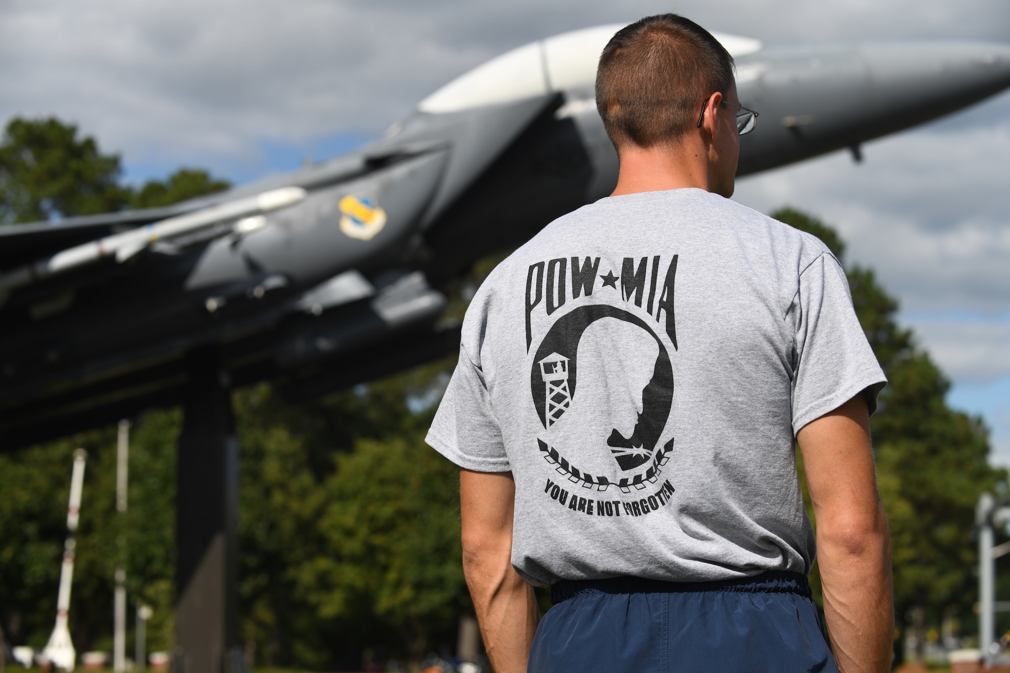 MSgt Elijah Docker, 4th Component Maintenance Squadron assistant first sergeant, looks on during the POW/MIA Ceremony on Sept. 18, 2019, at Seymour Johnson Air Force Base, North Carolina. Docker was chosen as the first runner of the flag during the kick-off of the National POW/MIA Remembrance Day 24 hour marathon. (U.S. Air Force photo by Staff Sgt Michael Charles)