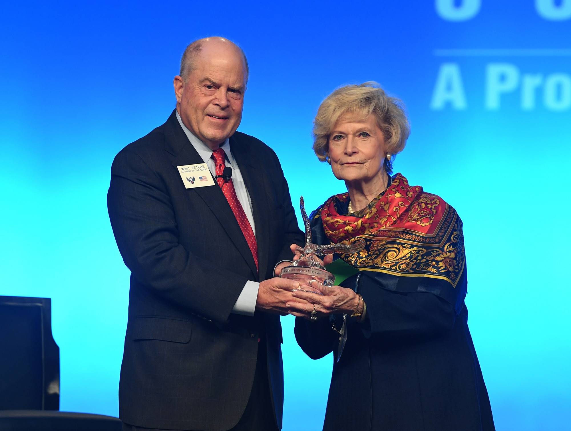 Dr. Lucy Greene receives the W. Parker Greene Legacy Award from Whit Peters, Chairman of the Air Force Association Board, during the Air Force Association Air, Space and Cyber Conference in National Harbor, Md. For more than 40 years, Dr. Greene and her late husband W. Parker Greene have been staunch advocates for Airmen and the mission at Moody Air Force Base. (U.S. Air Force photo by Andy Morataya)