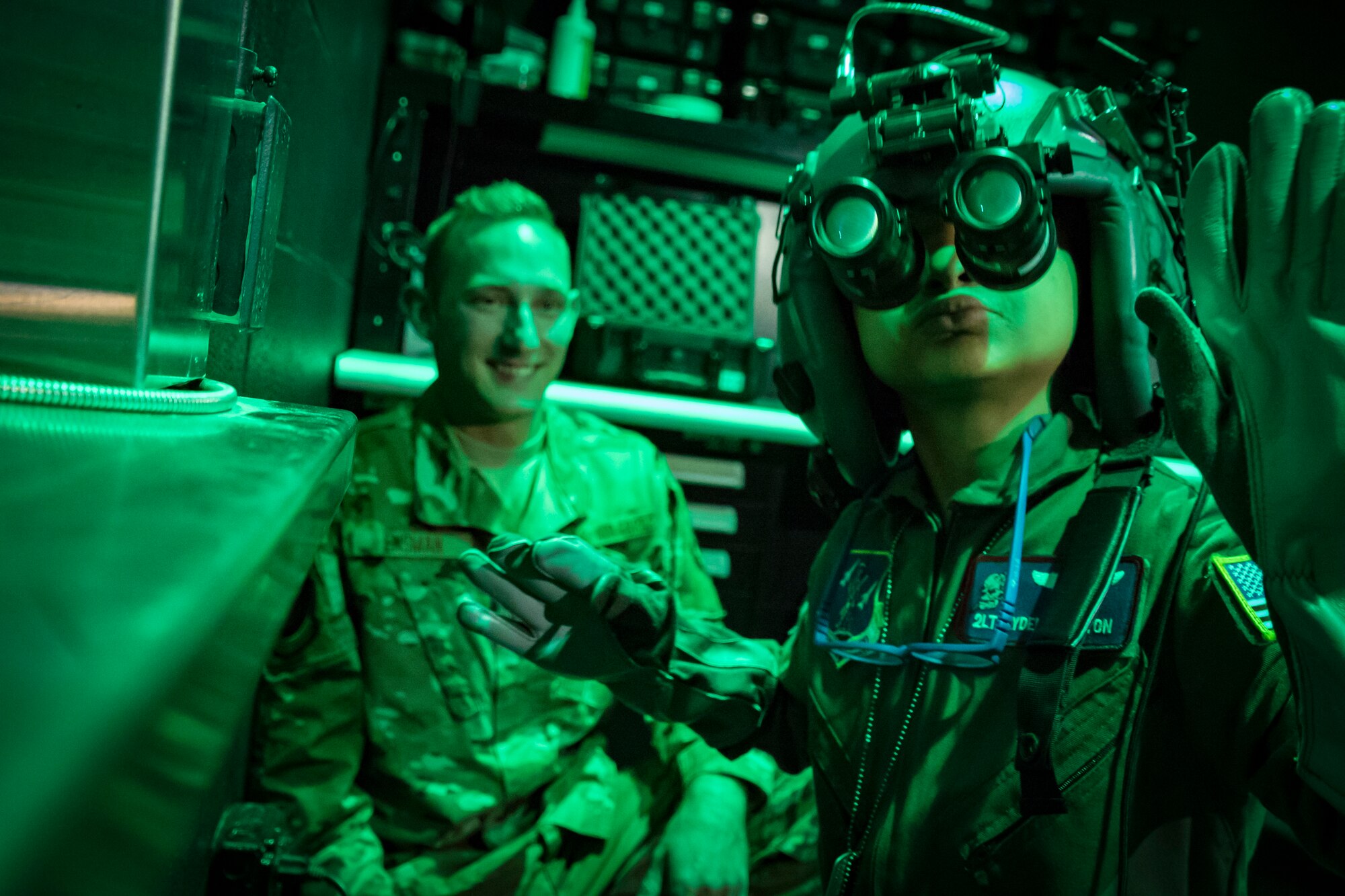 Staff Sgt. Josh Ensman, Aircrew Flight Equipment, shows Ayden Houston the pilots helmet after being named an honorary "Pilot for a Day" as part of a special event, Sept. 15, 2019, at the 179th Airlift Wing, Mansfield, Ohio. The 164th Airlift Squadron, assigned to the 179 AW,  collaborated with “A Special Wish Foundation” of Cleveland, Ohio, to provide Ayden with this unique experience he could share with his family who have been battling a variety of health issues with Ayden since birth. (U.S. Air National Guard photo by Tech. Sgt. Joe Harwood)