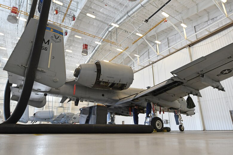 U.S. Air Force Airman 1st Class Grace Mathews, 355th Component Maintenance Squadron fuel system journeyman, enters the inside of an A-10 Thunderbolt II fuel tank while her attendant watches over her at Davis-Monthan Air Base, Arizona, Sept. 17, 2019.