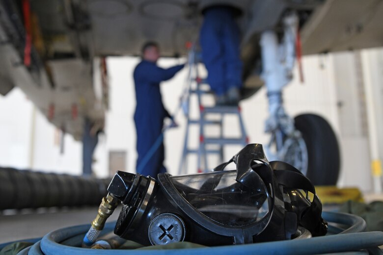 U.S. Air Force Airman 1st Class Grace Mathews, 355th Component Maintenance Squadron fuel system journeyman, enters the inside of an A-10 Thunderbolt II fuel tank while her attendant watches over her at Davis-Monthan Air Base, Arizona, Sept. 17, 2019.