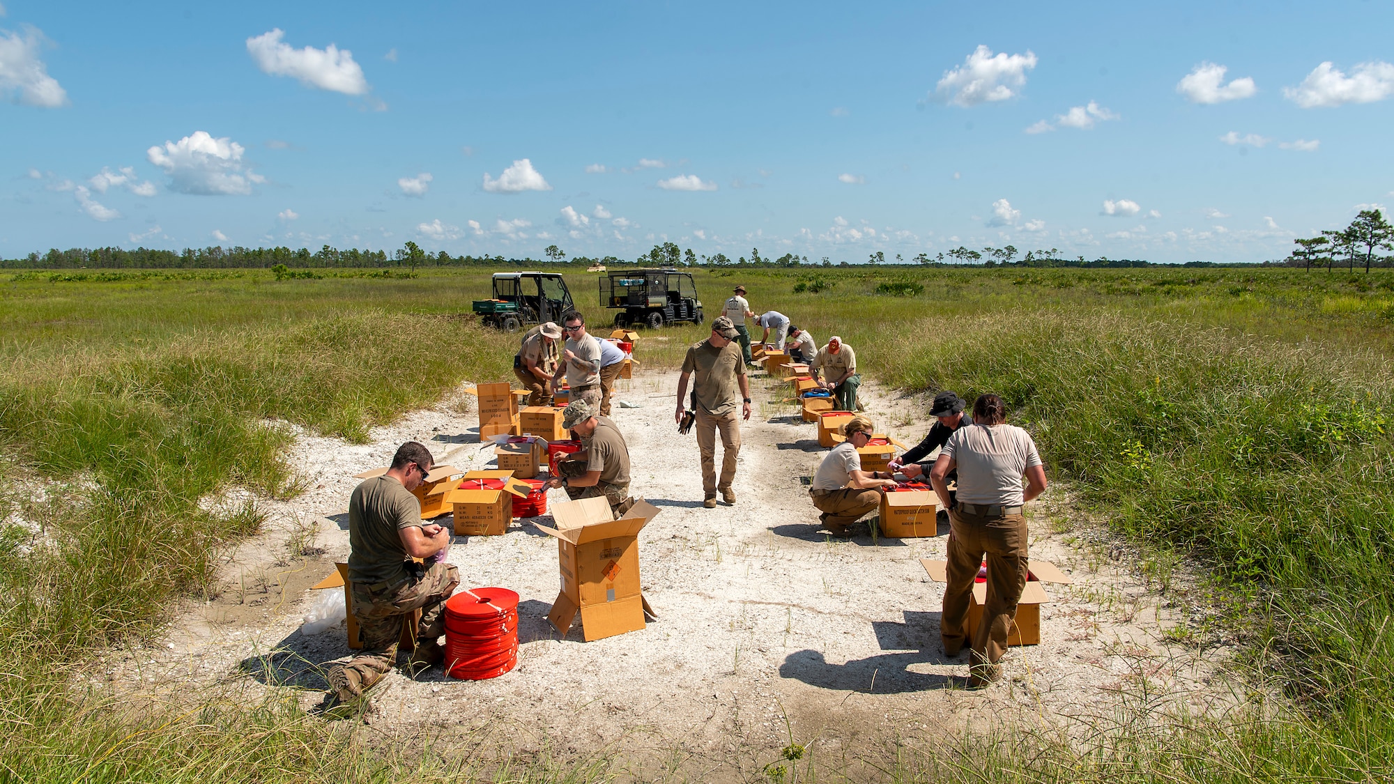 Members of the 6th Civil Engineer Explosive Ordnance Disposal Flight, the Bureau of Alcohol, Tobacco, Firearms and Explosives, and other local and state authorities, prepare to detonate evidence left over from a federal case during a joint training disposal procedure at the Avon Park Air Force Range, Fla., Sept. 9, 2019. The agencies disposed of the more than 7,000 pounds of explosives through controlled detonations.