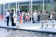 Soldiers and family members assigned to the Houston Medical Recruiting Company render honor during the singing of the National Anthem by Otis Toussaint, 5th Medical Recruiting Battalion, at the unit's change of command ceremony at Hermann Park Conservancy, Houston, Texas, Sept. 5.