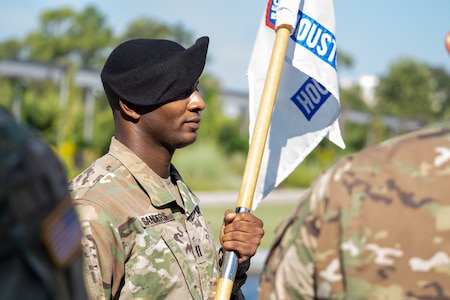 Capt. Ryan Sanders, outgoing commander, Houston Medical Recruiting Company, passes the guidon during the Houston Medical Recruiting Company change of command ceremony, at Hermann Park Conservancy, Houston, Texas, Sept. 5.