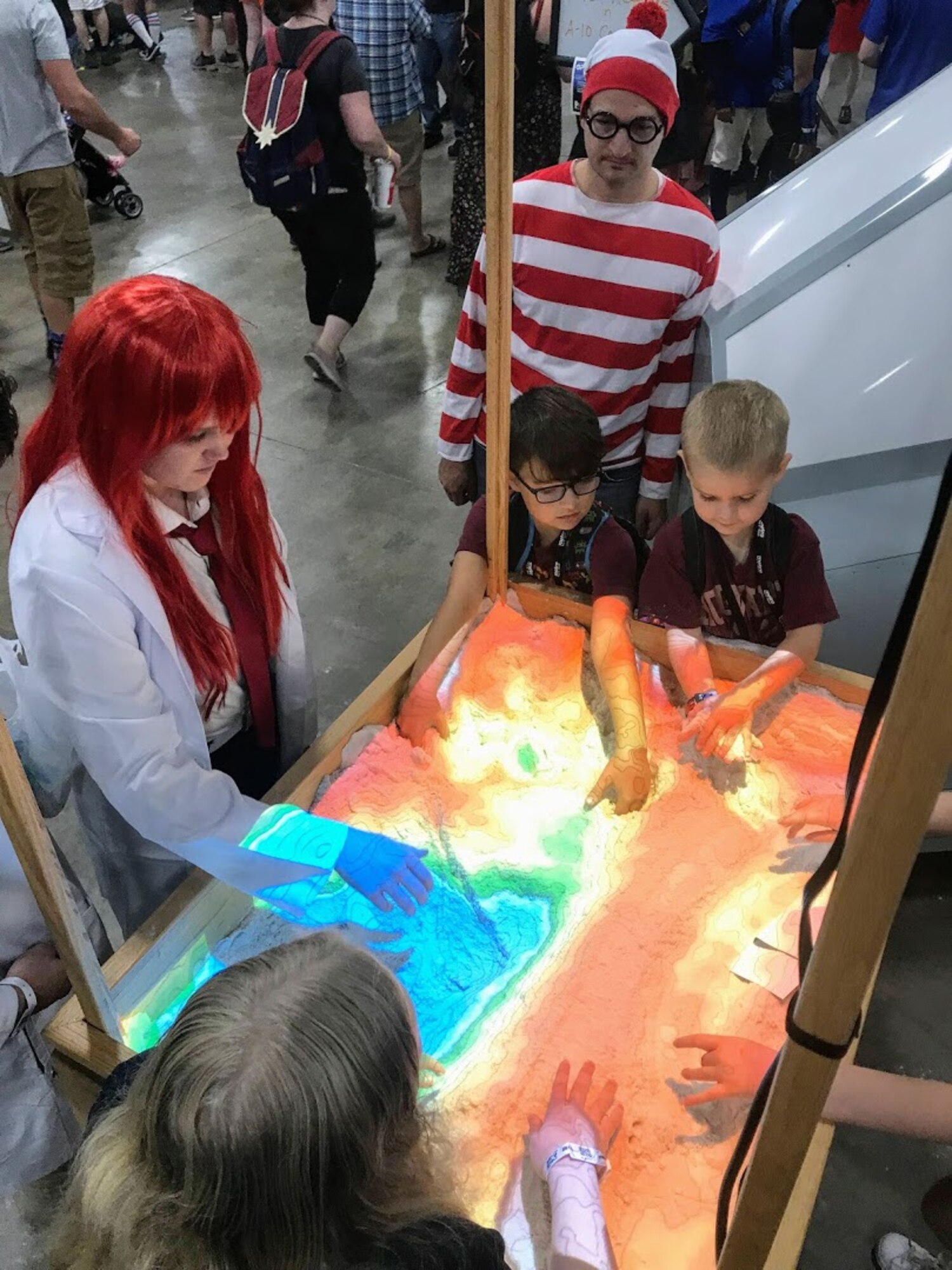Participants at the 2019 FanX event play with a 3D interactive topographical map sandbox the Hill Air Force Base Science, Technology, Engineering and Math exhibit.  The event, which  was held at the Salt Palace Convention Center Sept. 5-7, drew thousands of visitors, providing great exposure for Hill and its STEM programs.