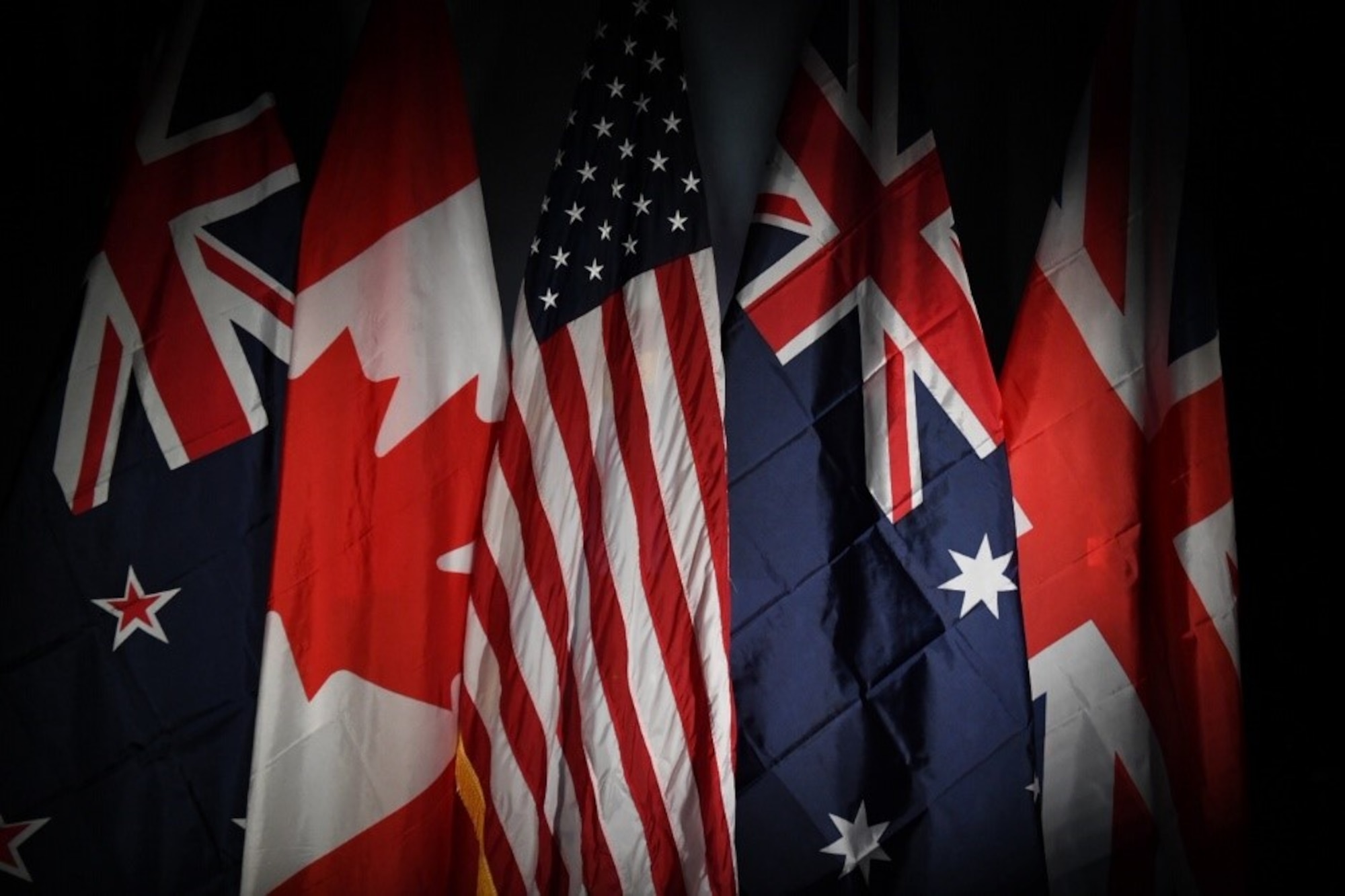 From left to right, the New Zealand, Canadian, United States of America, Australian and United Kingdom flag are displayed together representing the allied forces at Buckley Air Force Base, Colo., Sept. 12, 2019.