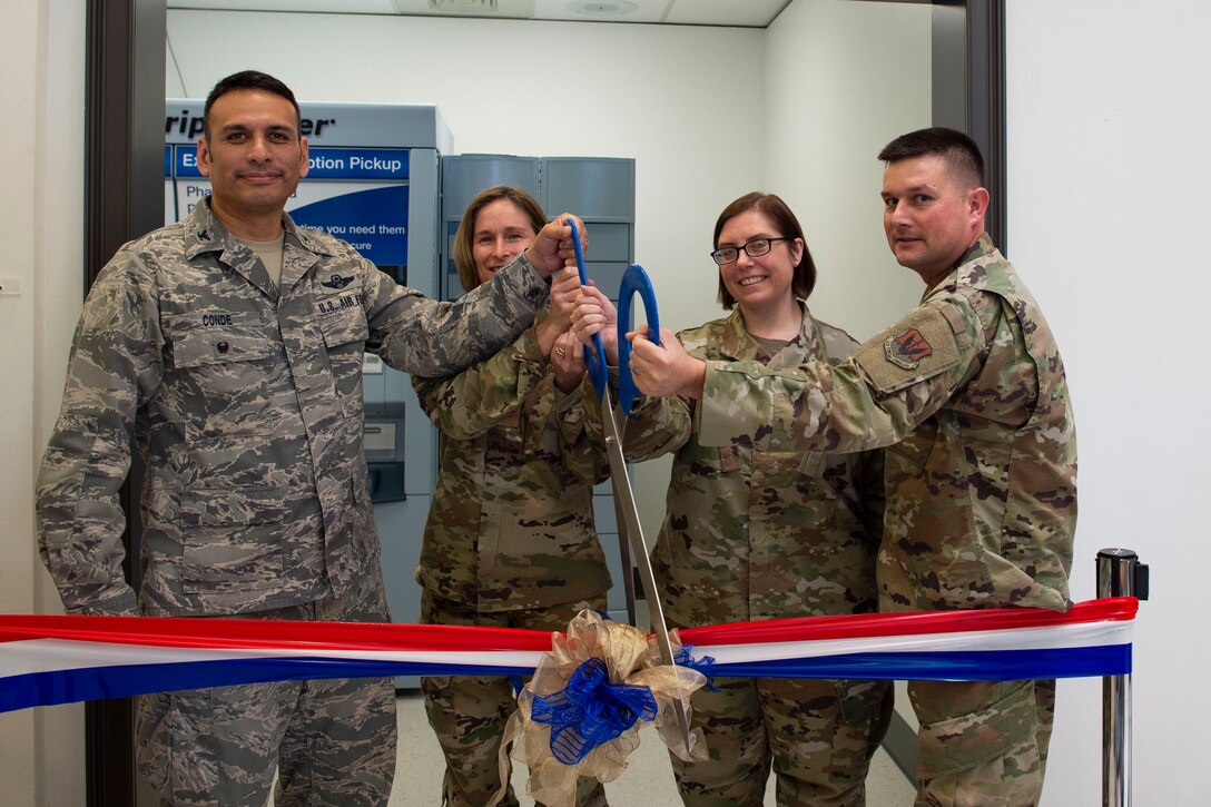 Leadership from the 23d Wing cut a ribbon during the opening of the ScriptCenter Sept. 19, 2019, at Moody Air Force Base, Ga. The ScriptCenter is a machine that stores and dispenses various medications to customers and is intended to streamline the main pharmacy refill and dispensing services for Airmen, their families and retirees. (U.S. Air Force photo by Airman Azaria E. Foster)