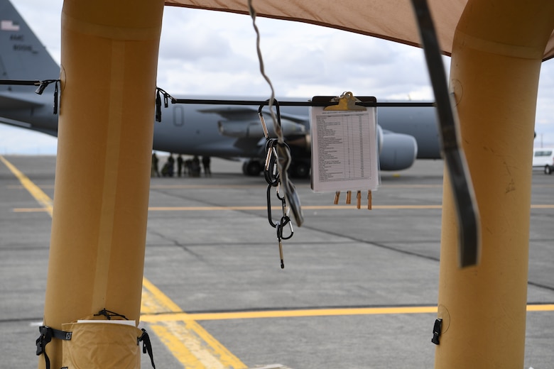 A decontamination checklist hangs from a decontamination station ready to receive affected aircrew and passengers during Exercise Mobility Guardian at Yakima Air Terminal-McAllister Field, Washington, Sept. 16, 2019. Exercise Mobility Guardian brings together U.S. Air Force, joint and international partners from more than two dozen nations enhancing the vital partnerships needed to accomplish the mission. (U.S. Air Force photo by Tech. Sgt. Luther Mitchell)