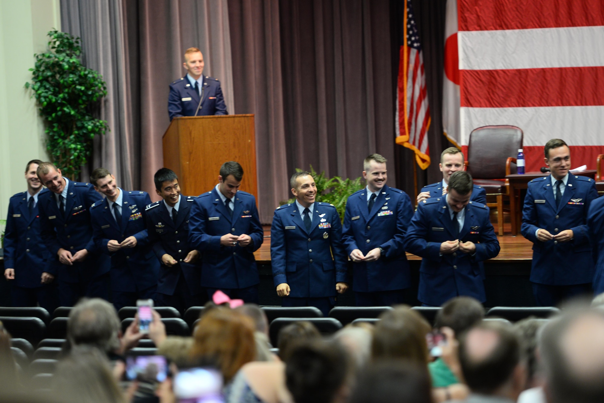 Graduating class 19-23/24 break their silver wings, Sept. 13, 2019, on Columbus Air Force Base, Mississippi. This process is an honored tradition where new Air Force pilots break their first set of Silver Wings for good luck, and the two halves are not supposed to be reunited until the pilot is deceased. (U.S. Air Force photo by Airman 1st Class Jake Jacobsen)