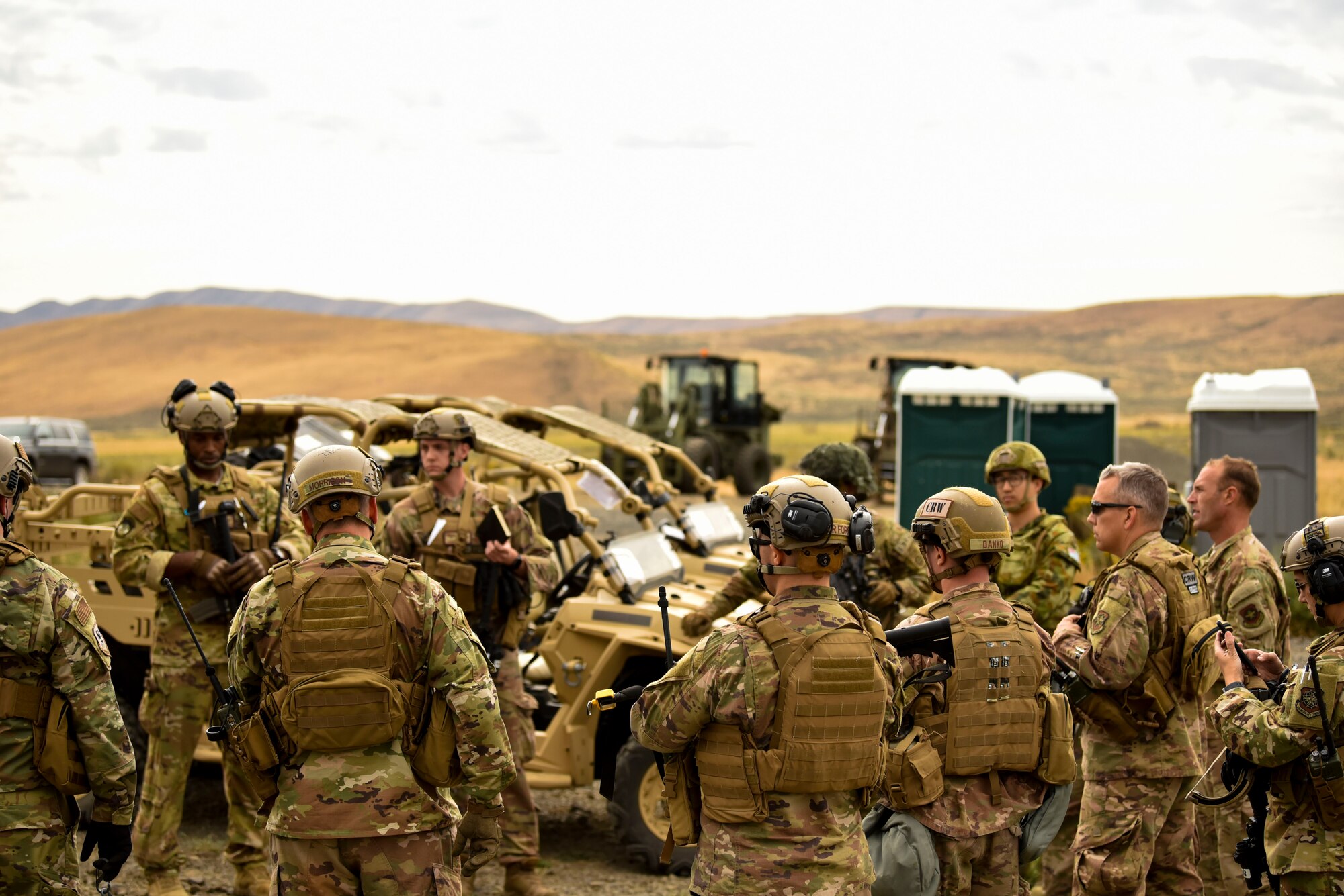 U.S. Air Force Airmen, U.S. Army Soldiers and Australian Royal Air Force Airmen plan how to proceed with the next stage of their Joint Forcible Entry operation during Air Mobility Command’s Mobility Guardian exercise.