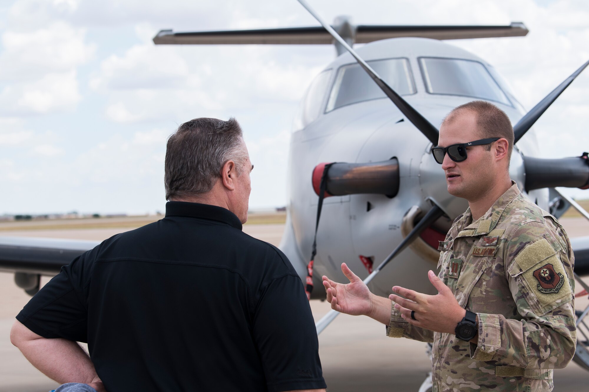 Capt. Andrew Smith, 318th Special Operations Squadron pilot, answers the questions asked by Jim Haley, Clovis Christian Schools superintendent, during Teachers Understanding Deployment Operations at Cannon Air Force Base, N.M, Sept. 14, 2019. TUDOS is a program made to educate teachers and faculty of local schools about what military life is like and how it can affect the children of military members. (U.S. Air Force photo by Senior Airman Vernon R. Walter III)
