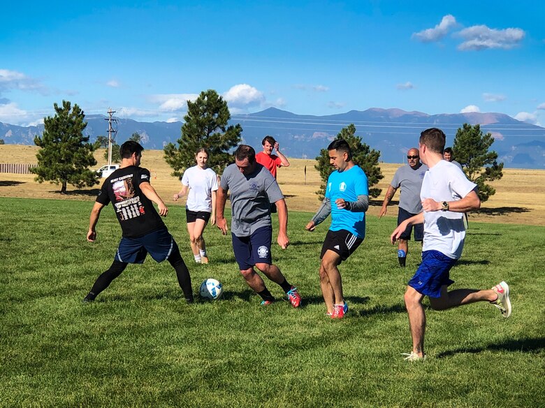 Airmen play soccer during the 9/11 remembrance soccer tournament at Schriever Air Force Base, Colorado, Sept. 11, 2019. The tournament was held Sep. 9-11 as a way to reflect on the tragic event and connect through camaraderie and sportsmanship. (U.S. Air Force photo by Capt. Ronald Lawrence)