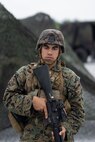 U.S. Marine Lance Cpl. Gabriel Marrero, a fire directional control specialist with Headquarters Battery, 12th Marine Regiment, 3rd Marine Division, stands security during Thunder Field Training Exercise on Camp Hansen, Okinawa, Japan, Sept. 18, 2019. The purpose of the exercise is to rehearse setting up an expeditionary combat operations center and refine procedures for doing so. Marrero is a native of Atlantic City, N.J. (U.S. Marine Corps photo by Pfc. Jamal Norris)