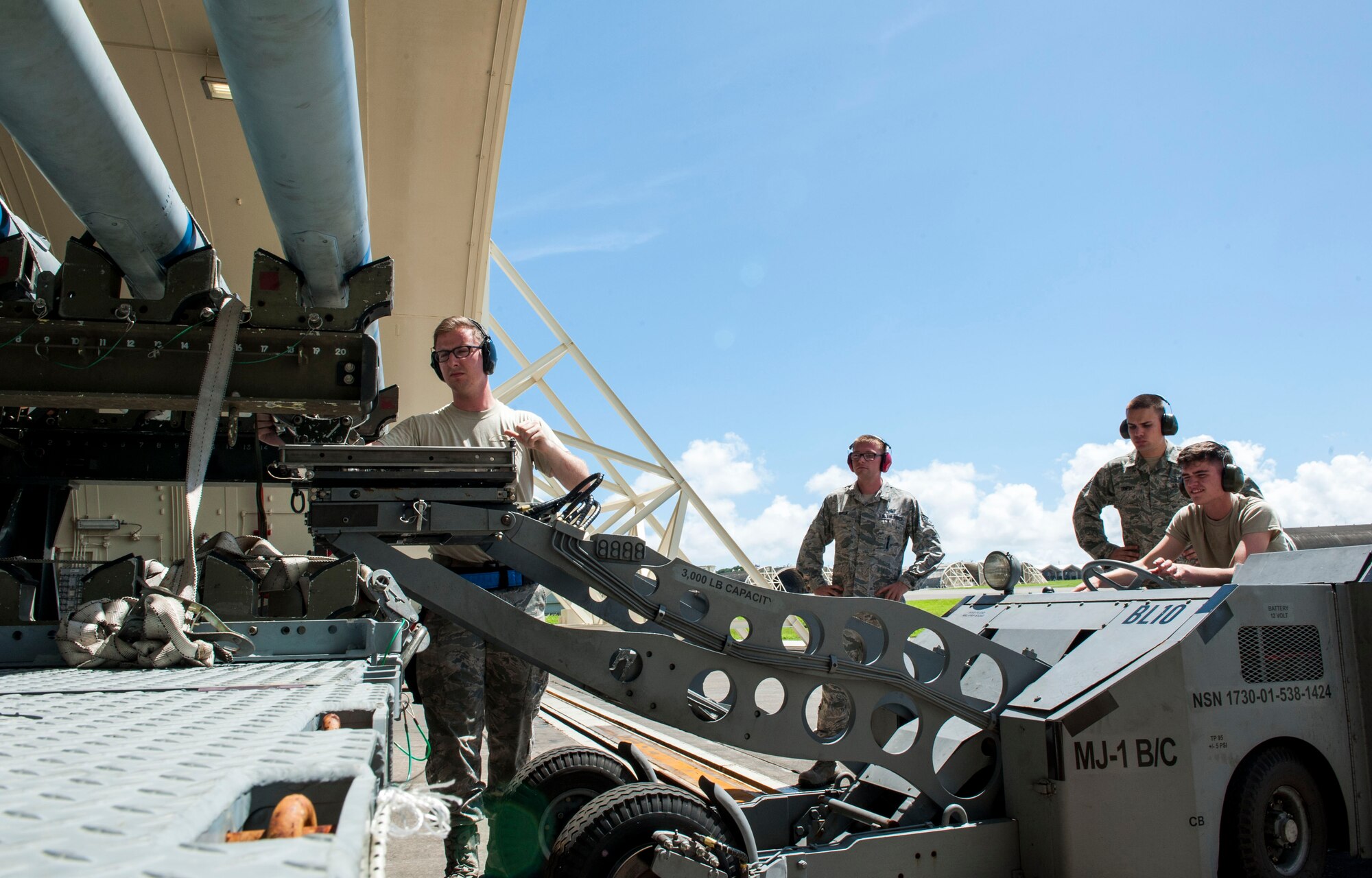 U.S. Air Force Airman Staff Sgt. Jeremy Devlin, 44th Aircraft Maintenance Unit weapons load crew chief, loads an AIM-120 advanced medium-range air-to-air missile onto an MJ-1C lift truck during initial certification training at Kadena Air Base, Japan, Sept. 11, 2019. The 18th Maintenance Group provides training for more than 2,000 aircraft maintainers and munitions handlers. The group also provides maintenance support and facilities for all other forces assigned to or transiting to Kadena AB. (U.S. Air Force photo by Naoto Anazawa)