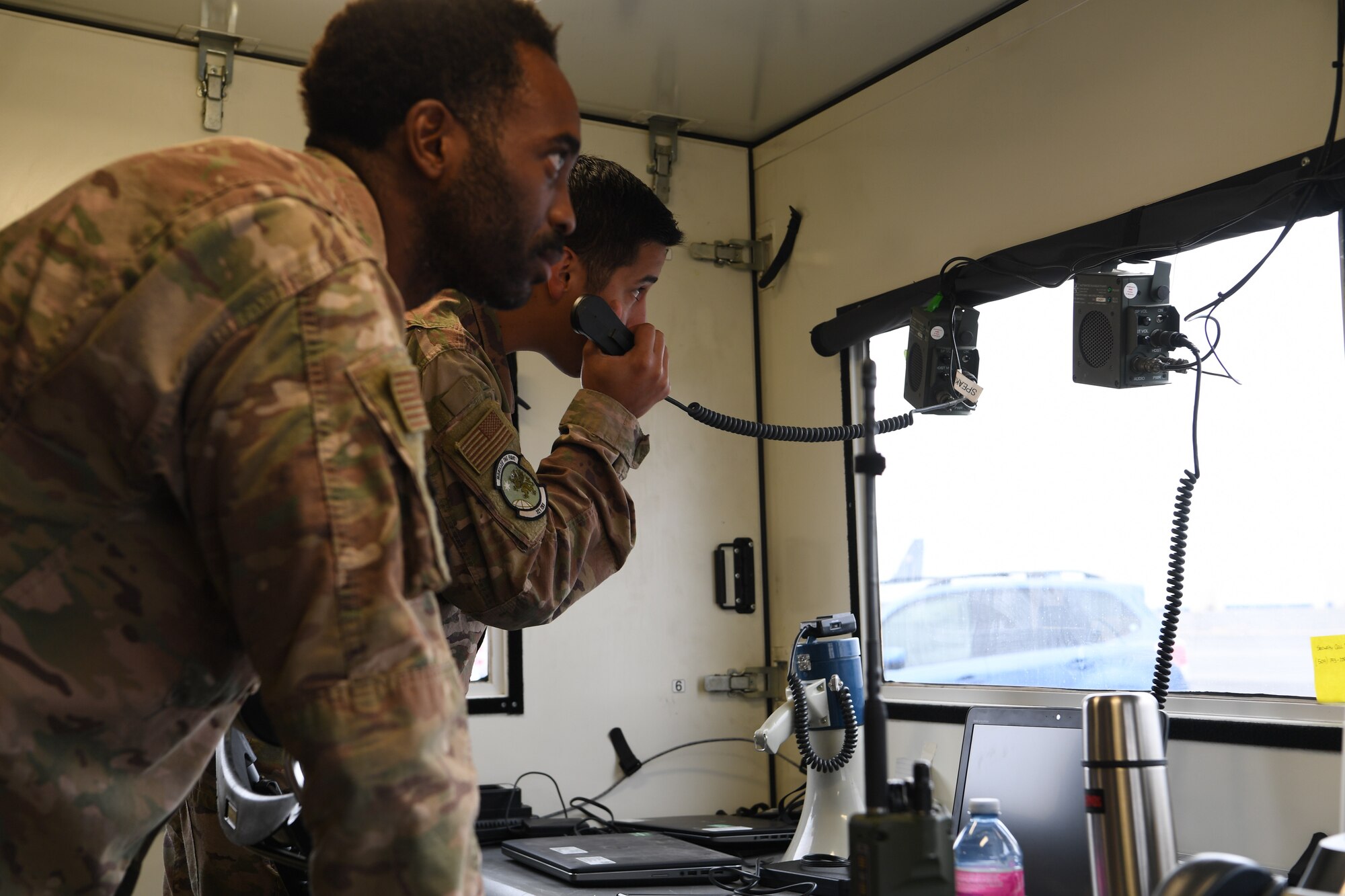 Master Sgt. Jeremiah Ibarra, left, 321st Contingency Response Team chief, Travis Air Force Base, California responds to an simulated inflight emergency during Exercise Mobility Guardian at Moses Lake, located west of Fairchild Air Force Base, Washington. Mobility Guardian test joint and total force response to threats faced in the current fight and potential higher-end threats in future wars. (U.S. Air Force photo by Tech. Sgt. Luther Mitchell Jr.)