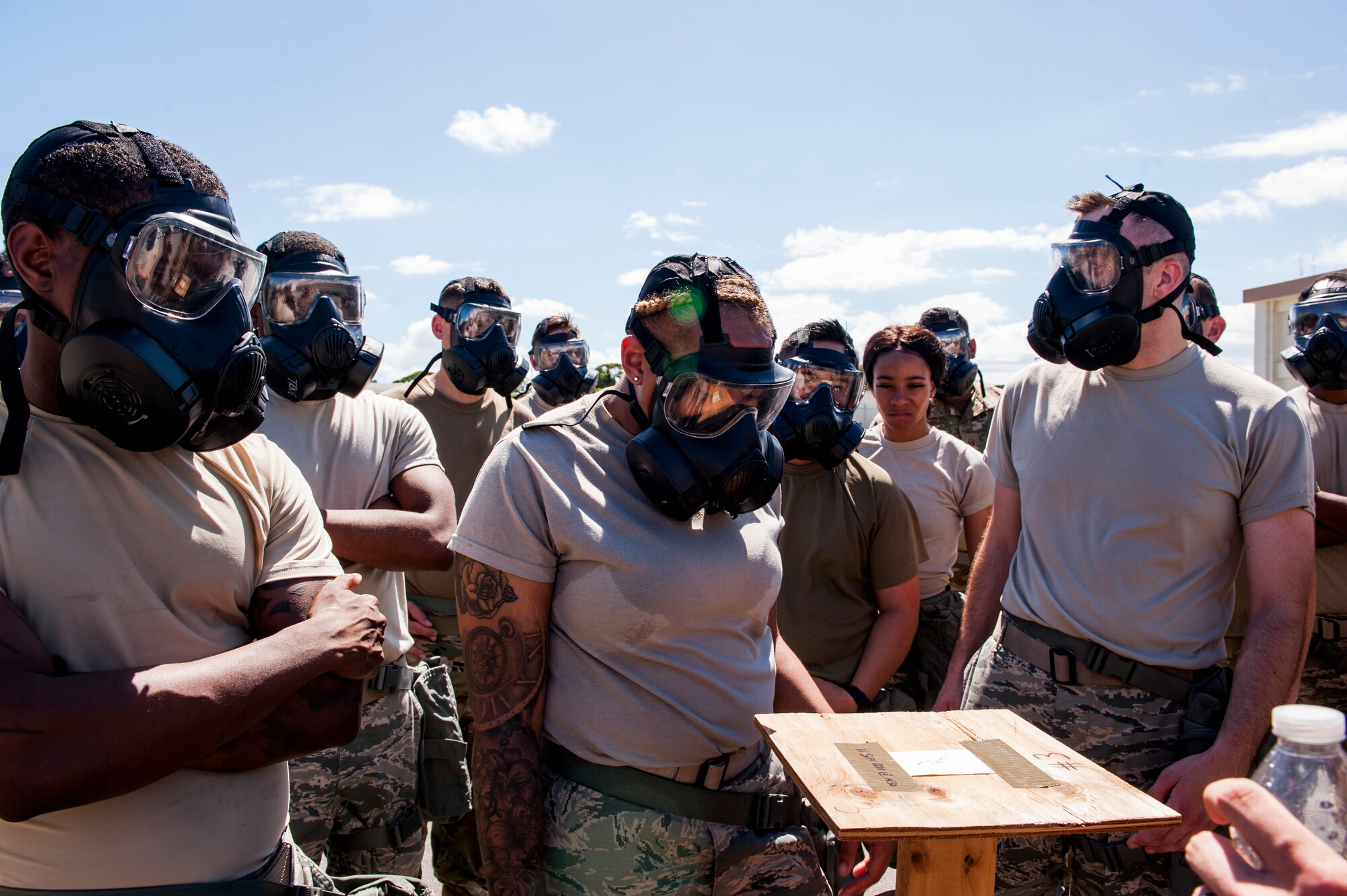 Airmen review M8 chemical agent detector paper during Ability to Survive and Operate training at Kadena Air Base, Japan, Sept. 12, 2019. The M-8 paper is used to detect chemicals such as nerve and blister agents that an Airmen could be exposed to in the event of an attack. (U.S. Air Force photo by Naoto Anazawa)