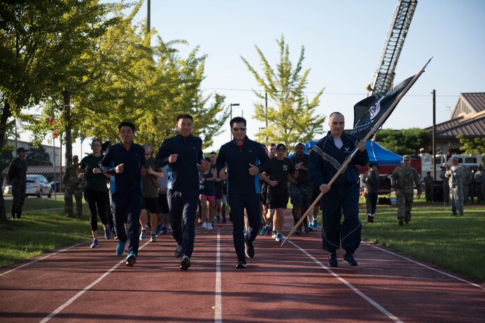 U.S. Air Force Col. Lawrence Sullivan (far right), 8th Fighter Wing vice commander, runs with Republic of Korea Air Force’s 38th Fighter Group leadership to start a 24-hour prisoners of war and missing in action memorial run at Kunsan Air Base, Republic of Korea, Sept. 19, 2019. The Wolf Pack held several events throughout the week, such as a 10 kilometer ruck march, a memorial run and a candle light vigil. (U.S. Air Force photo by Senior Airman Stefan Alvarez)