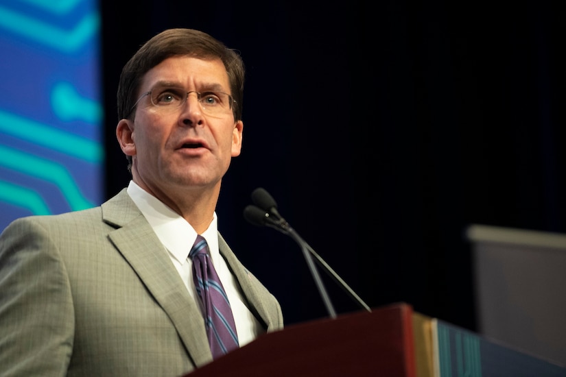 Defense Secretary Dr. Mark T. Esper speaks from behind a podium.