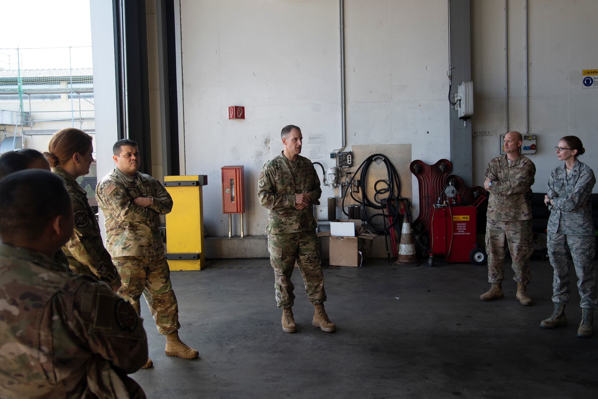 U.S. Air Force Col. Matthew S. Husemann, center, 86th Airlift Wing vice commander, speaks with members of the 86th Vehicle Readiness Squadron at Ramstein Air Base, Germany, Sept. 19, 2019.