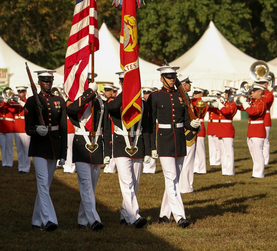 Marines with the Official Marine Corps Color Guard march off the deck during the 37th annual Enlisted Awards Parade in MCB Quantico, Virginia, Sept. 18, 2019. The Enlisted Awards Parade is held every year to recognize the individual achievements of enlisted Marines throughout the Marine Corps. (U.S. Marine Corps photo by Lance Cpl. Allen Sanders)