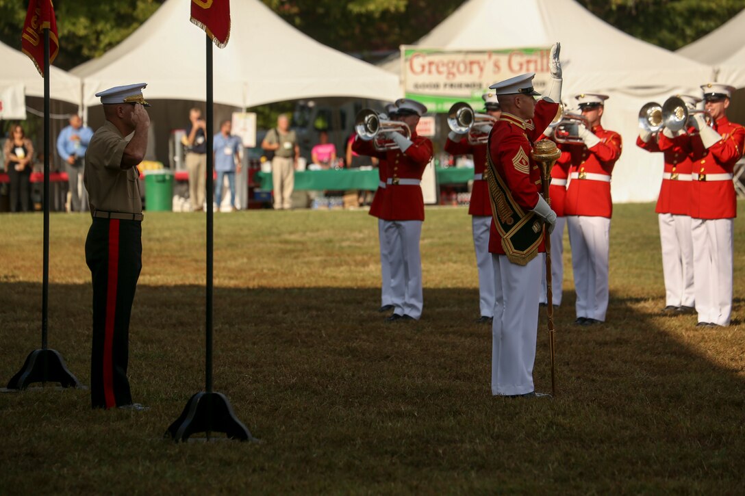 General David H. Berger, commandant of the Marine Corps, renders a salute during honors conducted by Master GySgt Keith Martinez, drum major, “The Commandant’s Own” U.S. Marine Drum and Bugle Corps, during the 37th annual Enlisted Awards Parade at MCB Quantico, Virginia, Sept. 18, 2019. The Enlisted Awards Parade is held every year to recognize the individual achievements of enlisted Marines throughout the Marine Corps. (U.S. Marine Corps photo by Lance Cpl. Allen Sanders)