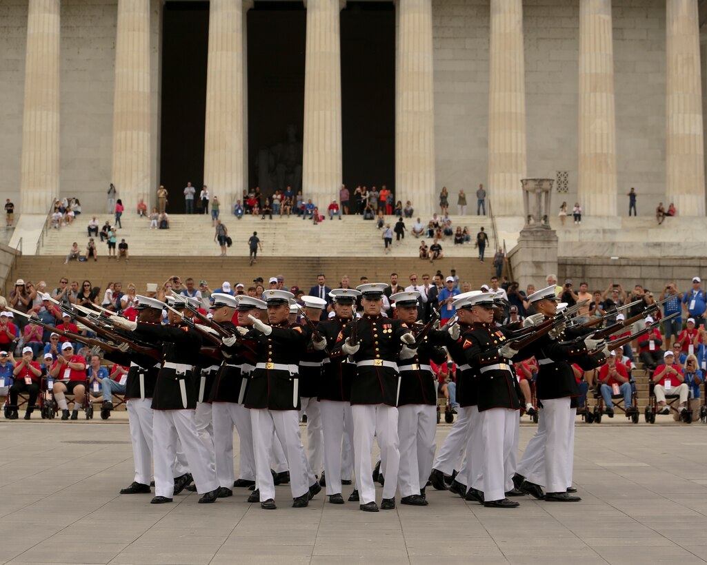 Marines with the U.S. Marine Corps Silent Drill Platoon conduct their “bursting bomb” sequence during an honor flight at the Lincoln Memorial, Washington, D.C., Sept. 17, 2019. Honor Flights provide no cost transportation for U.S. military veterans to visit Washington D.C. and see the memorials of the respective wars they served in. (U.S. Marine Corps photo by Lance Cpl. Allen Sanders)