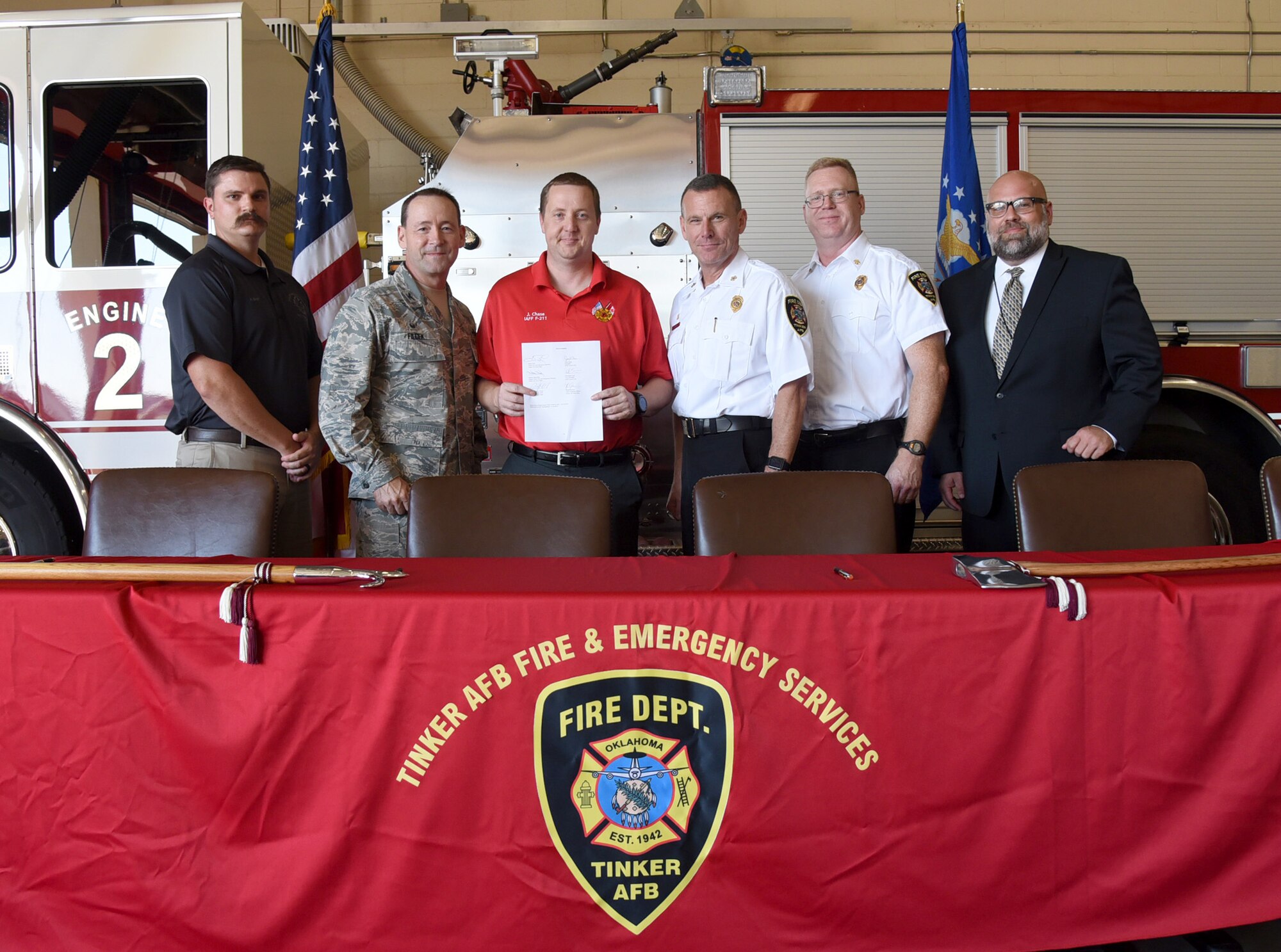 An image of Tinker Firefighters signing Local Supplement Agreement from 1994.