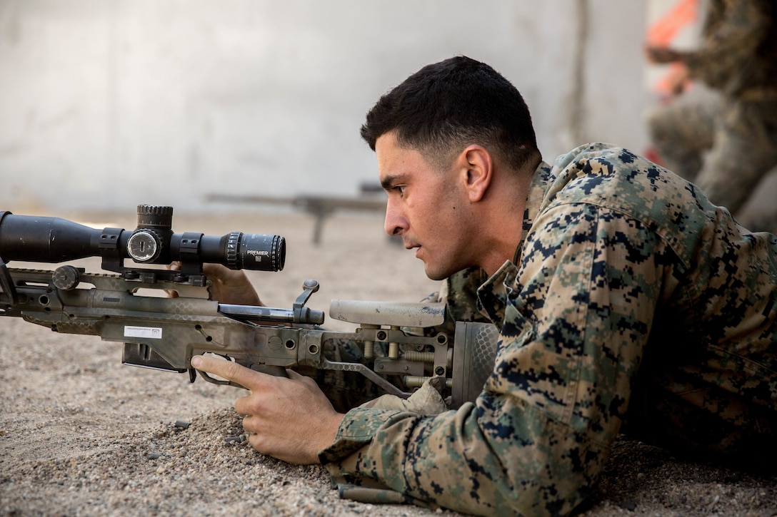A U.S. Marine with Special Purpose Marine Air-Ground Task Force-Crisis Response-Africa 19.2, Marine Forces Europe and Africa, loads an M110 semi-automatic sniper system at Moron Air Base, Spain, Aug. 30, 2019. Marines conducted training to increase marksmanship proficiency on their sniper system. SPMAGTF-CR-AF is deployed to conduct crisis-response and theater-security operations in Africa and promote regional stability by conducting military-to-military training exercises throughout Europe and Africa. (U.S. Marine Corps photo by Cpl. Margaret Gale)